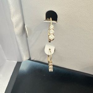 14kt yellow gold .4 ct diamond earrings hoops. Fish hook omega back earring.